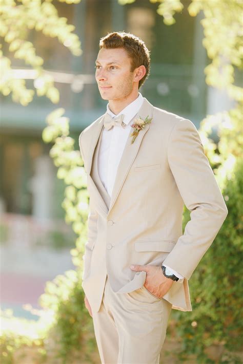 tan suit gold tie
